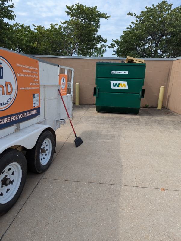 Dumpster area after PhD Junk Removal cleared it